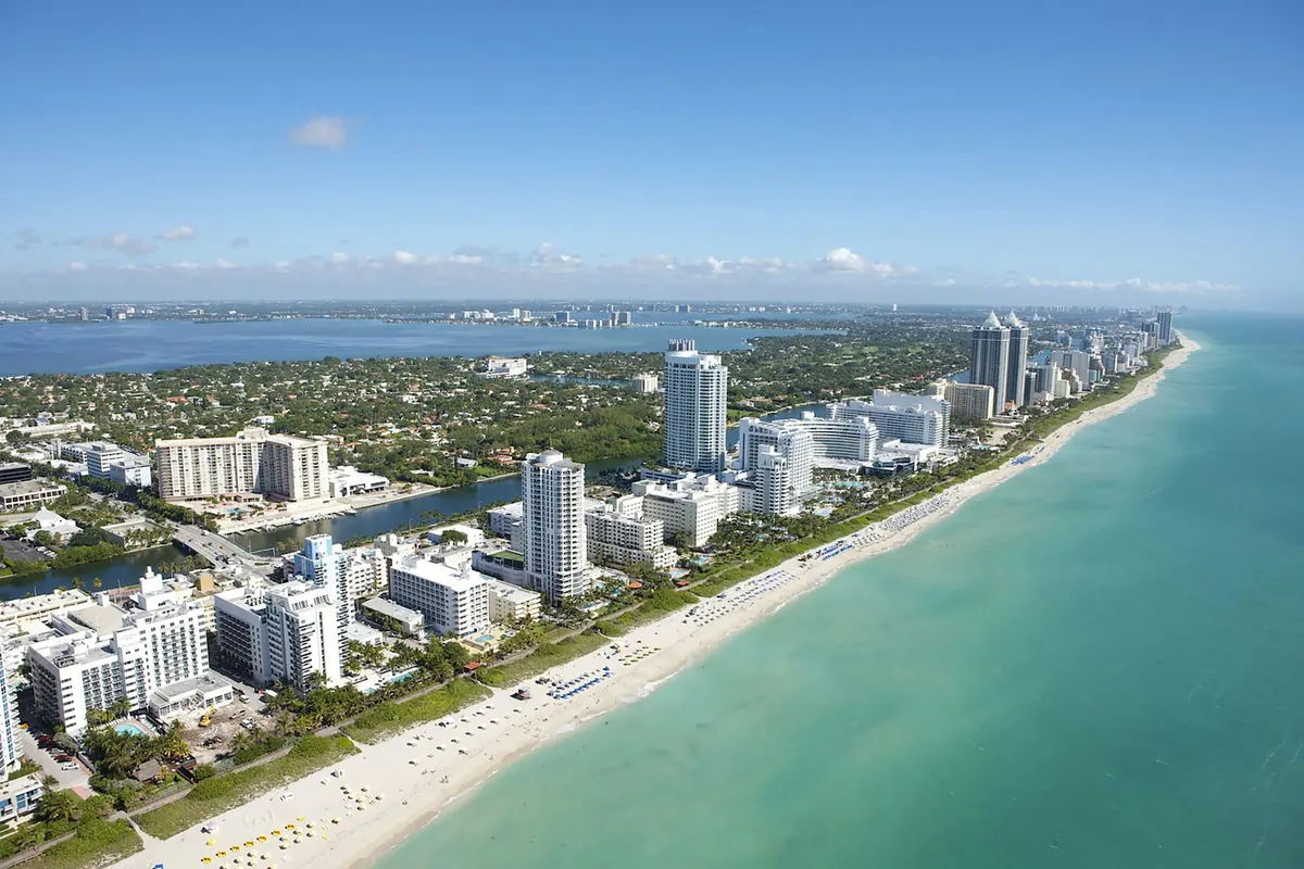 The South Florida shoreline and beach towers from the air